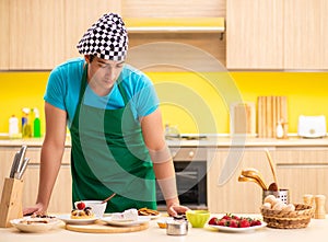 Young professional cook preparing in kitchen