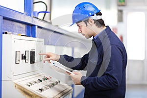 Young professional electrician at work