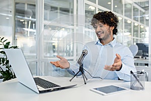 Young professional engaging in an animated online discussion