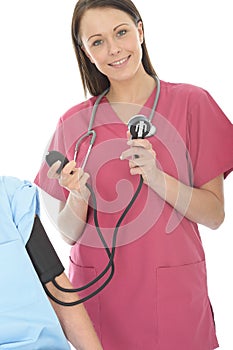 Young Professional Happy Relaxed Female Doctor Taking The Blood Pressure Of A Patient