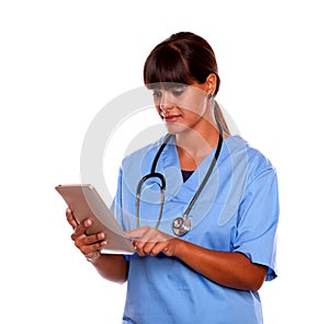 Young professional nurse using her tablet pc