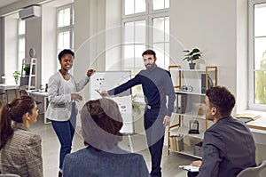 Multiracial people team employees of progressive company oversees presentation in spacious office