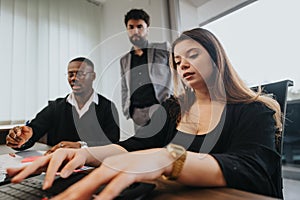 Young professionals engage in a strategic business meeting at a modern office