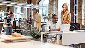 Young professionals. Group of multiracial business people working together in the creative co-working space