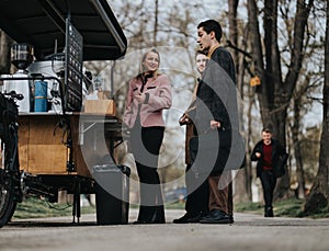 Young professionals strategizing at an outdoor meeting near a coffee cart