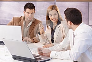 Young professionals teamworking in meeting room photo