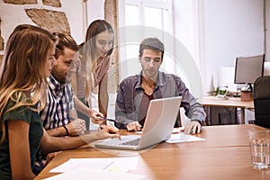 Young professionals watching a new presentation