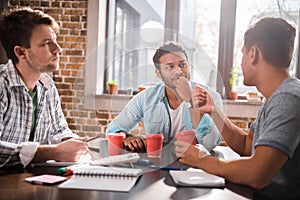 Young professionals working on business project together