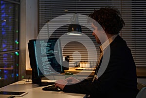 Programmer working with codes on computer