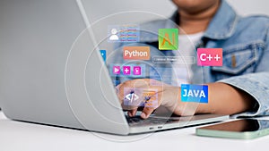 Young student coding on laptop with programming languages Python Java C++ AI technology concept