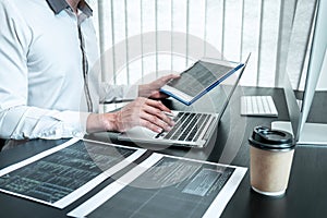 Young Programmer working in software javascript computer in IT office, Writing codes and data code website and coding database