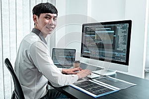Young Programmer working in software javascript computer in IT office, Writing codes and data code website and coding database