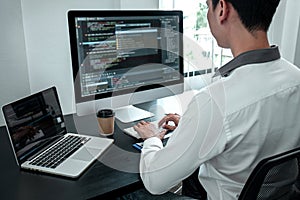 Young Programmer working in software javascript computer in IT office, Writing codes and data code website and coding database