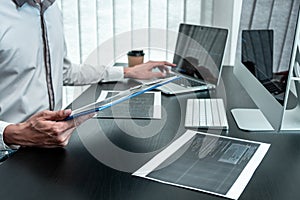 Young Programmer working in software javascript computer in IT office, Writing codes and data code website and coding database