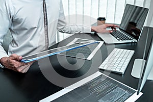 Young Programmer working in software javascript computer in IT office, Writing codes and data code website and coding database