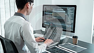 Young Programmer working in software javascript computer in IT office, Writing codes and data code website and coding database