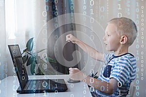 Young programmer writing code on a computer at home. Programming lessons, scratch for kids.