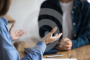 Young project leader woman telling business ideas to female colleague