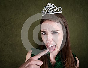 Young Queen Makes a Gagging Gesture
