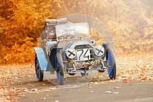 Young racer riding an old race car