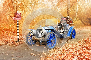 Young racer riding an old race car