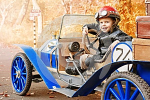 Young racer riding an old race car
