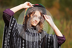 Young rastafarian woman in autumn park