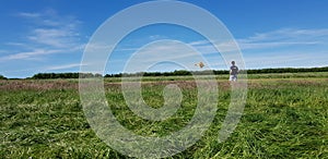 Young RC pilot takes a scale model plane to the skies.