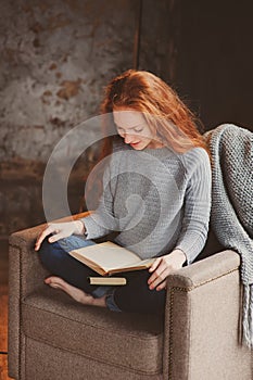 Young readhead student woman learning and reading books