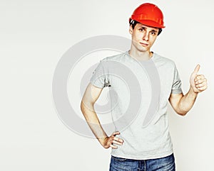 young real hard worker man isolated on white background on ladde