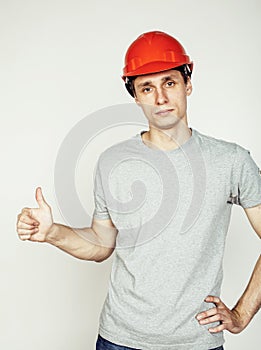 Young real hard worker man isolated on white background on ladder smiling posing, business concept