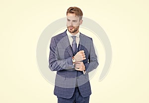 Young realtor fix sleeve button wearing fashion navy suit in business formal style, outfitting.