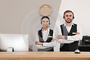 Young receptionists in professional uniform