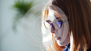 Young red hair officeworker women in glasses on the white background