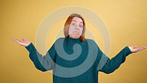 Young red hair woman posing isolated on yellow color background studio.