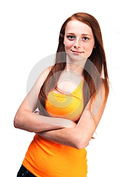 Young red-haired girl in a bright shirt. Isolated on white background