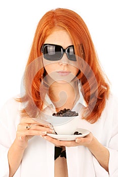 Young red-haired girl and coffee