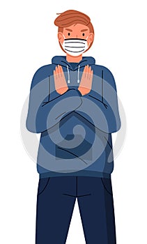 Young red-haired guy in medical mask show stop gesture to viral pandemia at white background photo