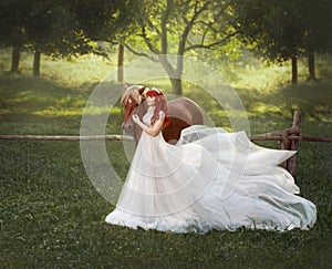 A young, red-haired princess in a crystal tiara, hugs and strokes her horse. The background is a fantastic forest glade