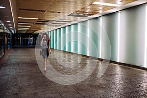 Young redhead business woman walking to work