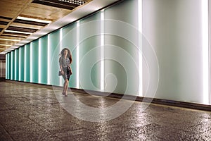 Young redhead business woman walking to work