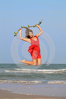 Young redhead girl jumping