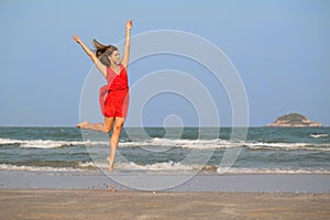 Young redhead girl jumping