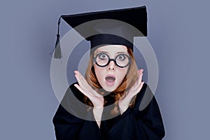 Graduate girl in square academic cap and mantle