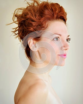 Young redhead with punky hair and tragus piercing
