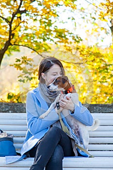 Young redhead woman in blue dress with pet