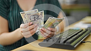 Young redhead woman business worker counting romanian leu banknotes at office