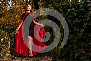 Young redhead woman in a forest