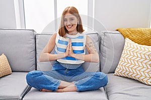 Young redhead woman  at home