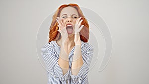 Young redhead woman screaming loudly over isolated white background